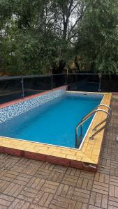 a large swimming pool with a slide in it at Пар&Речка in Almaty +12 photos