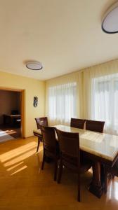 a dining room with a table and chairs at Пар&Речка in Almaty
