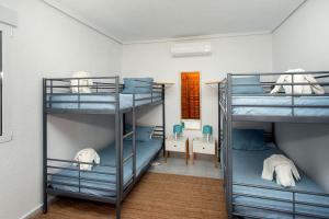 a room with three bunk beds in a room at CH Villa Mare Ciudad Quesada in Ciudad Quesada +42 photos