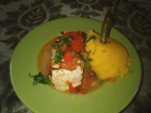 a green plate of food on a table at LEBADA de VARA in Mahmudia
