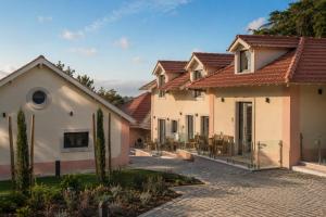 a row of houses with a driveway at Quinta da Maquia Hotel in Sintra