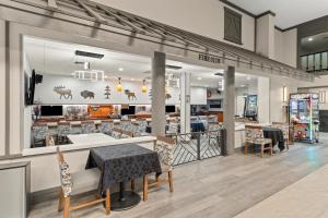 a restaurant with a table and chairs in a store at Red Lion Hotel & Conference Center Cheyenne in Cheyenne