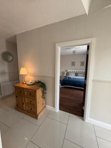 a bedroom with a door leading to a bed at Teach Duff in Clonmany