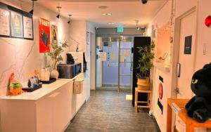 a room with a hallway with a counter and a door at Hotel AMY in Incheon