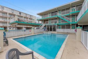 a swimming pool in front of a apartment building at 3110 Atlantic Ave, Unit 304 in Wildwood