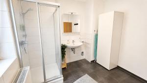 a bathroom with a sink and a shower at Comfortable new Apartment in #Koblenz# direkt am Rhein in Koblenz