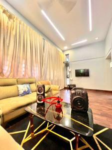 a living room with a table with a camera on it at Nature View Friends Villa - The Dream Stays ll Infinity Big pool ll 3Rooms ll Wi-Fi in Lonavala