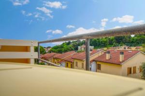 a view of roofs of houses from a balcony at Casa Alice in Numana