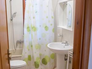 a bathroom with a sink and a shower curtain at Charming Apartment in Velina, 90 m², Mountain View in Castelnuovo Cilento