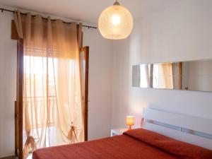 a bedroom with a bed and a window at Charming Apartment in Velina, 90 m², Mountain View in Castelnuovo Cilento +16 photos