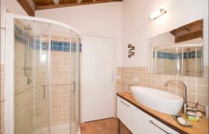 a bathroom with a sink and a shower at Stonehouse LOFT MARTA in Vergato +10 photos