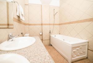 a bathroom with a sink and a tub and a toilet at Accommodation Dolcino in Ulcinj +33 photos