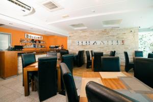 a restaurant with tables and chairs and a bar at Accommodation Dolcino in Ulcinj