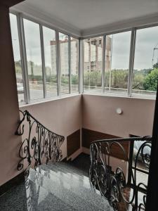 a balcony with windows and a wrought iron railing at Zarvantsi Hotel in Khmelëva +16 photos