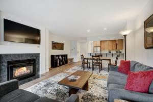 a living room with a couch and a fireplace at Seasons at Avon, A Vail Resorts Property in Avon