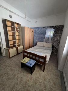 a bedroom with a bed and a table in it at Chora Residence in Khóra