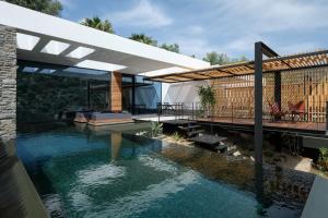 a swimming pool with a deck and a house at A - Luxury Villas in Plomari