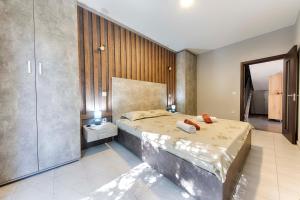 a bedroom with a large bed and a walk in shower at Villa & Pool in Utjeha +31 photos