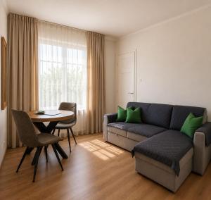 a living room with a couch and a table at 'tNest Middelaar in Middelaar