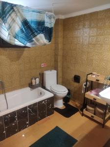 a bathroom with a toilet and a tub and a sink at Flat30 - Cosy apartment in Park of Kipseli- Xanthi in Xanthi