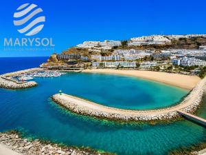 a view of a beach with boats in the water at Apartamentos Panamá in Puerto Rico de Gran Canaria +86 photos