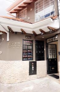 a building with a wine bar on the side of it at Casa Herrerías Hotel & Confort in Cuenca