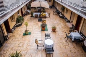 an overhead view of a patio with tables and chairs at Sandton hotel kasese in Nalakonge +8 photos