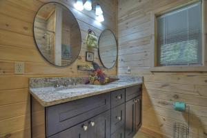 a bathroom with a sink and two mirrors at Blueberry Hill Fire Pit MTN Views Grill in McCaysville +25 photos
