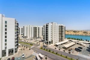 an aerial view of a city with tall buildings at Yas Island Luxury Apartment by City homes in Yas Island