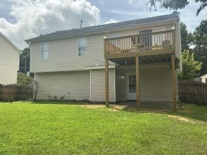 a house with a deck on top of it at Guest Suites in Conley