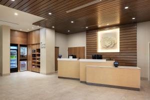 a lobby with a reception desk in a building at Fairfield Inn & Suites by Marriott Melbourne Beach in Melbourne +46 photos