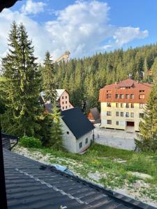 a view of a town with buildings and trees at Vlašić Moon Apartments in Vlasic