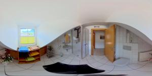a large bathroom with a sink and a shower at Gästehaus Sophie in Trittenheim