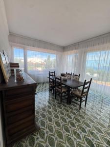 a dining room with a table and chairs at Villa Maria Marcella in Porto Santo Stefano +37 photos