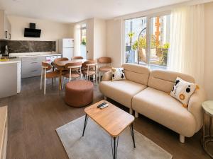a living room with a couch and a table at Berm Suites in Antalya
