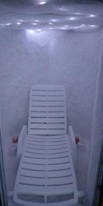 a white bench sitting in the inside of a boat at Mornov raj in Vuzenica