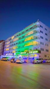 a large building with cars parked in front of it at فندق هدب - المربع in Riyadh
