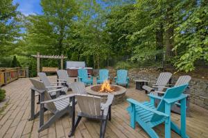 a group of chairs and a fire pit on a patio at The Moose House by Juniper Holiday + Home in New Buffalo