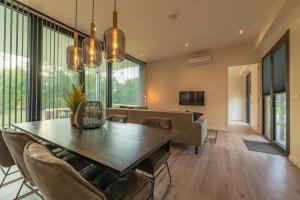 a dining room with a table and chairs at Forest Lodge 6 persons #624 in Maasbree