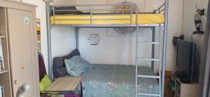 a small room with a bunk bed and a couch at Studio clim 4-5 pers animaux, mai oct spa et piscine in Saint-Ambroix