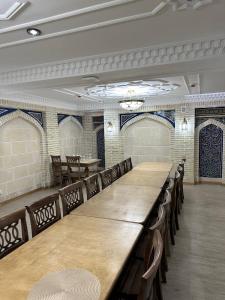 a large conference room with a long table and chairs at Amina Hotel PREMIUM in Bukhara