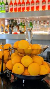two bowls filled with oranges on a table at Sfreg Suites Magenta - Camere e B&B in Magenta