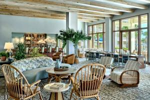 a living room with a couch and chairs and tables at Omni Amelia Island Resort & Spa in Amelia Island