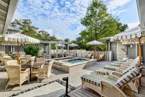 a patio with a table and chairs and a pool at Omni Amelia Island Resort & Spa in Amelia Island