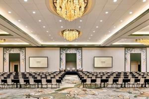 a conference room with chairs and a chandelier at Omni Amelia Island Resort & Spa in Amelia Island +124 photos