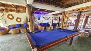 a room with a pool table and chairs at La Maringa El Magnifico in Libreville +54 photos