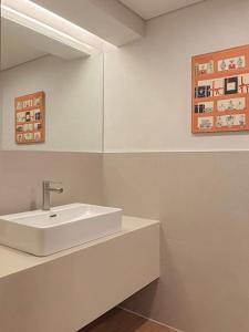 a bathroom with a white sink and a mirror at 무무 mumu in Seoul +114 photos