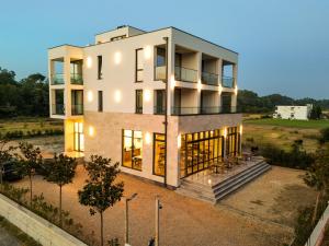 an aerial view of a house with lights at Velmare Inn in Ulcinj