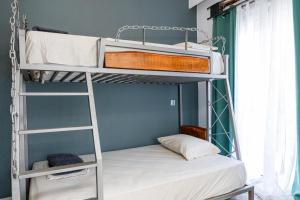 a bedroom with two bunk beds in a room at Vila Petro in Evkarpía +22 photos