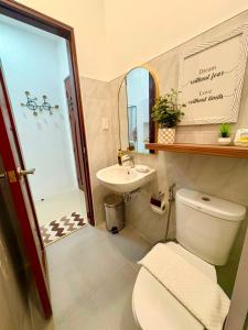 a bathroom with a toilet and a sink and a shower at Ramz Residence in El Nido +28 photos